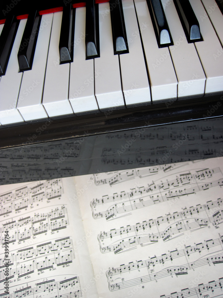 Fototapeta premium Piano keys with notes, musical background.