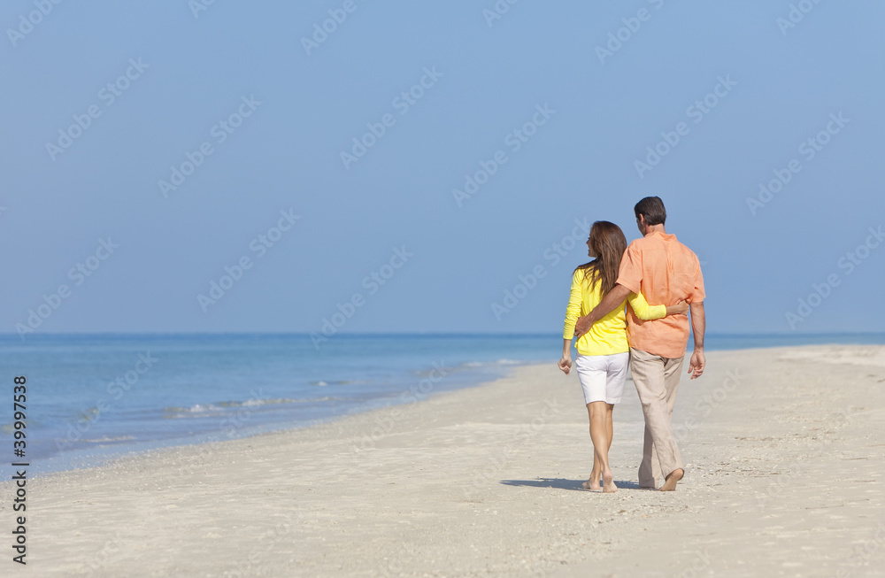 Couple Walking on An Empty Beach