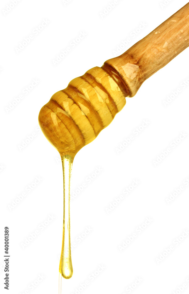 Wooden honey dipper with honey isolated on white Wooden honey dipper with honey isolated on white