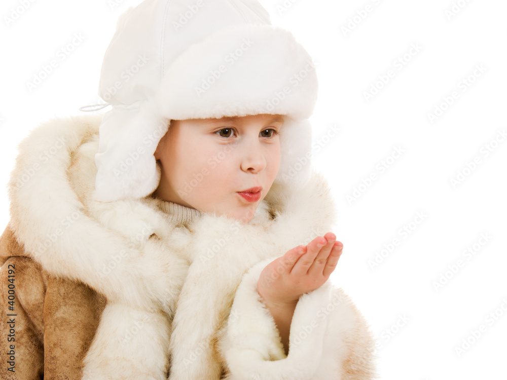 Girl in a sheepskin coat and cap sends a kiss Girl in a sheepskin coat and cap sends a kiss