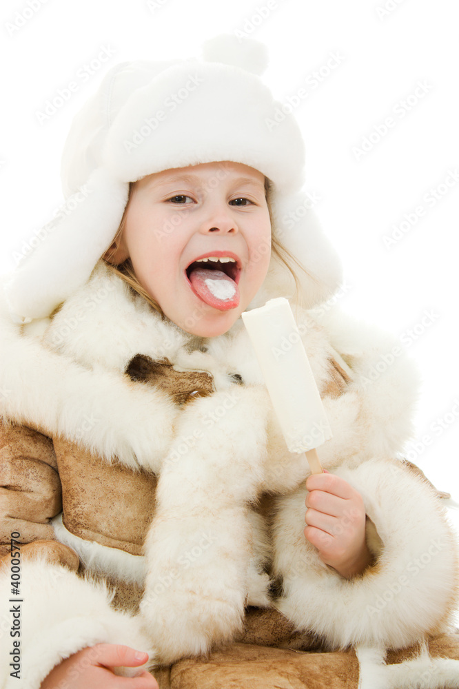 The girl in warm clothes eating ice cream The girl in warm clothes eating ice cream