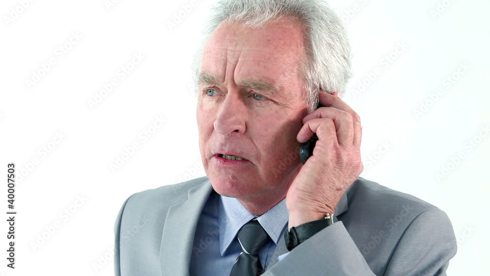 Serious man using his mobile phone Serious man using his mobile phone