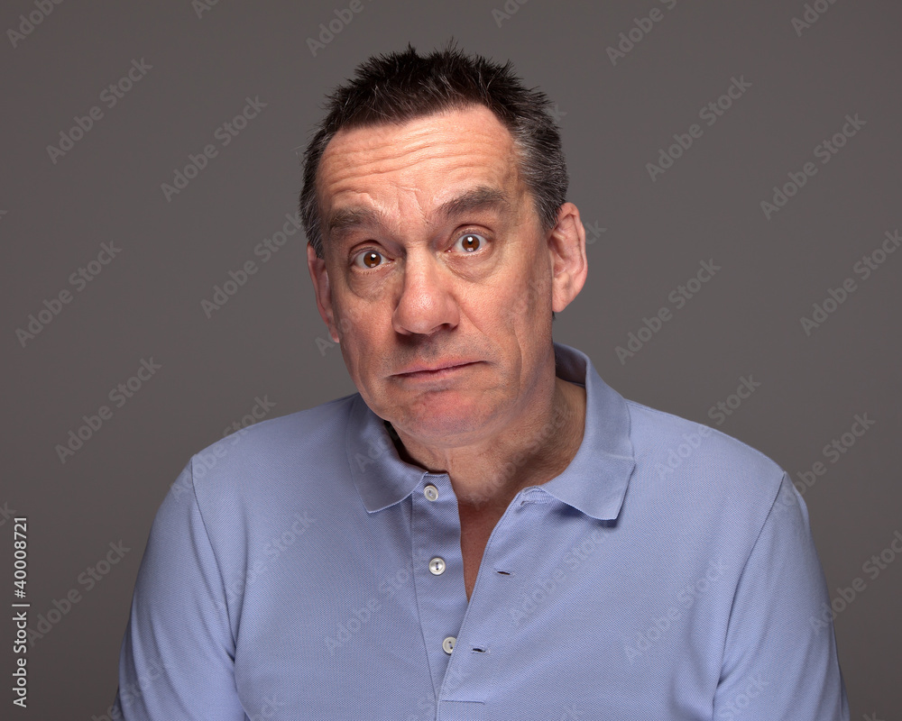 Middle Age Man with Surprised Sad Expression Middle Age Man with Surprised Sad Expression
