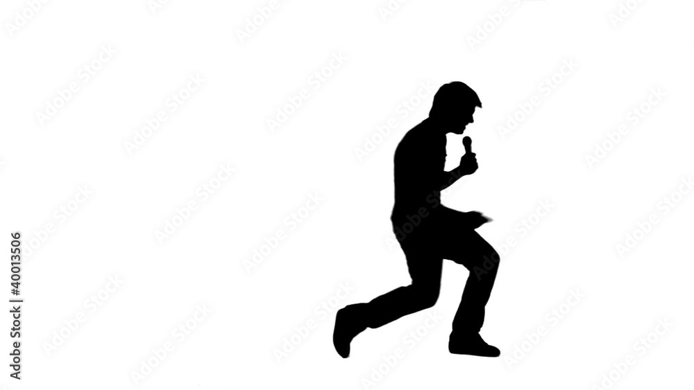 Silhouette energetic man holding a microphone Silhouette energetic man holding a microphone