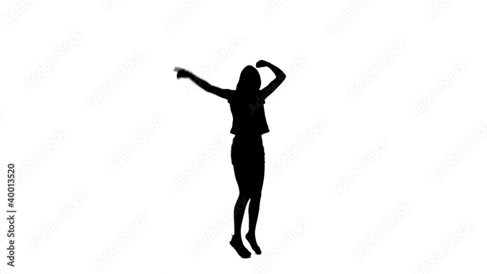Silhouette woman jumping with her arms raised Silhouette woman jumping with her arms raised