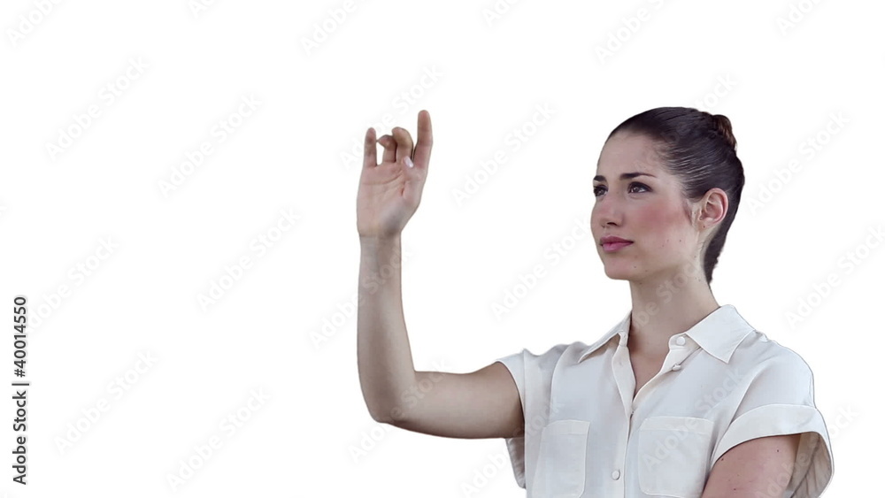 Businesswoman thoughtfully using a digital touchscreen Businesswoman thoughtfully using a digital touchscreen