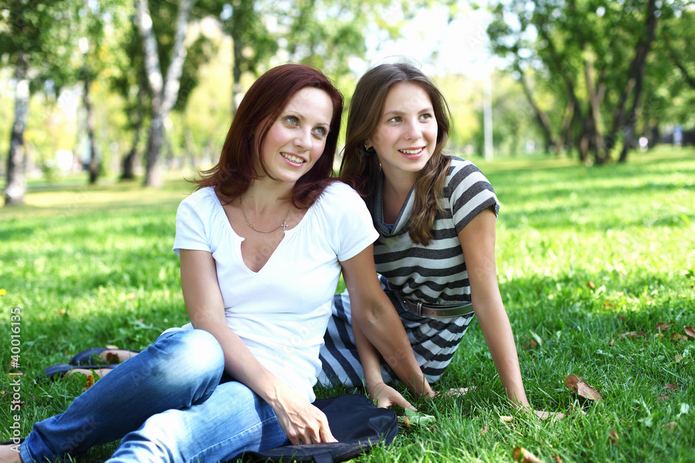 Mother with her daughter in summer park