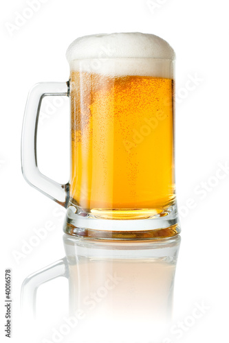 Mug fresh beer with cap of foam isolated on white background