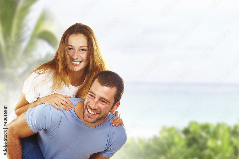 Portrait of a happy young couple having fun together in beach Portrait of a happy young couple having fun together in beach
