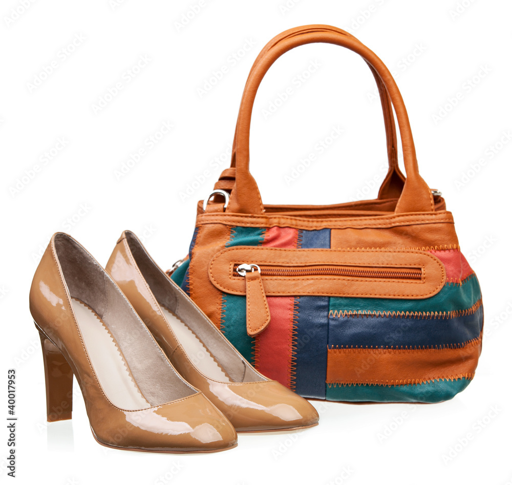 Pair of patent leather women shoes and bag over white Pair of patent leather women shoes and bag over white