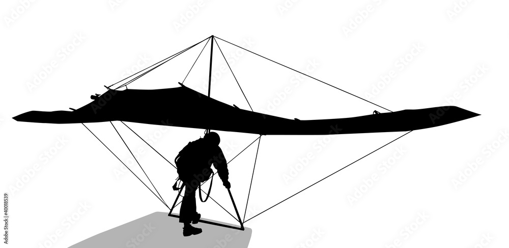 Silhouette of hang glider waiting to take off Silhouette of hang glider waiting to take off