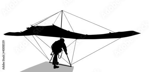 Silhouette of hang glider waiting to take off