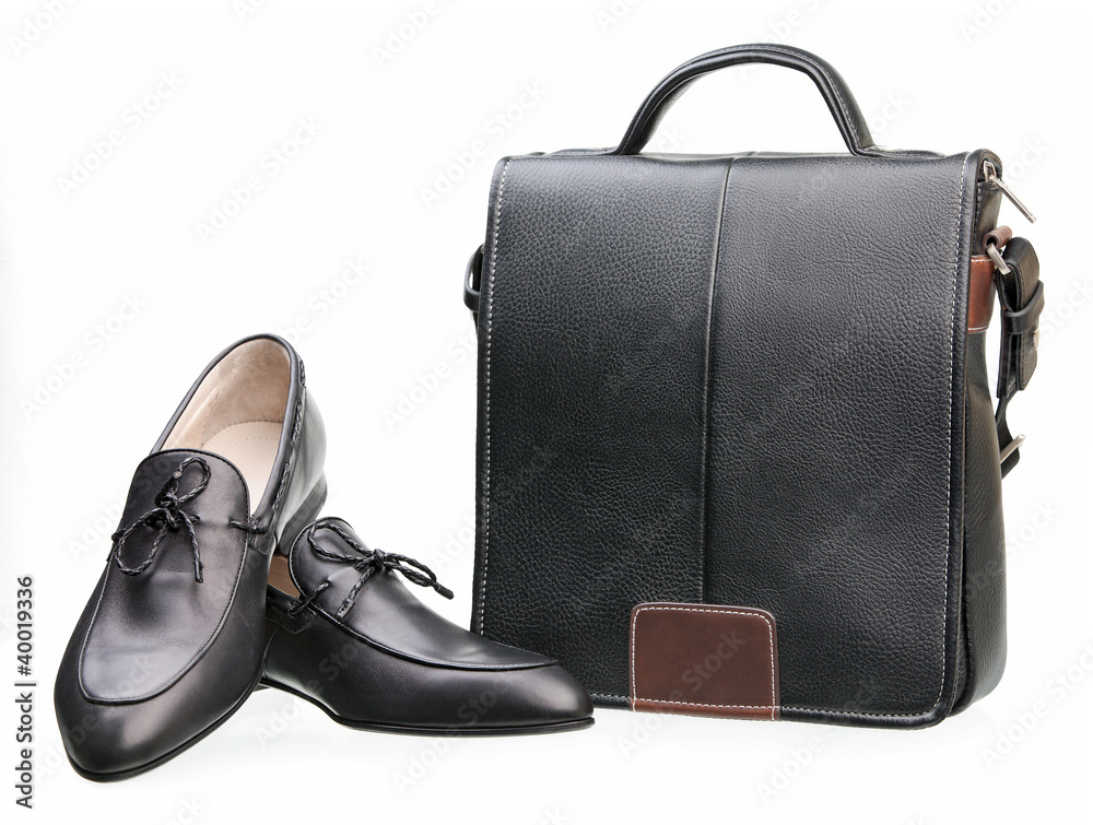 Naklejka premium Pair of black men shoes and messenger bag isolated over white