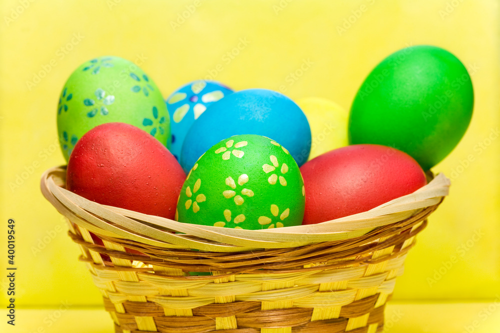 Colored eggs in basket Colored eggs in basket