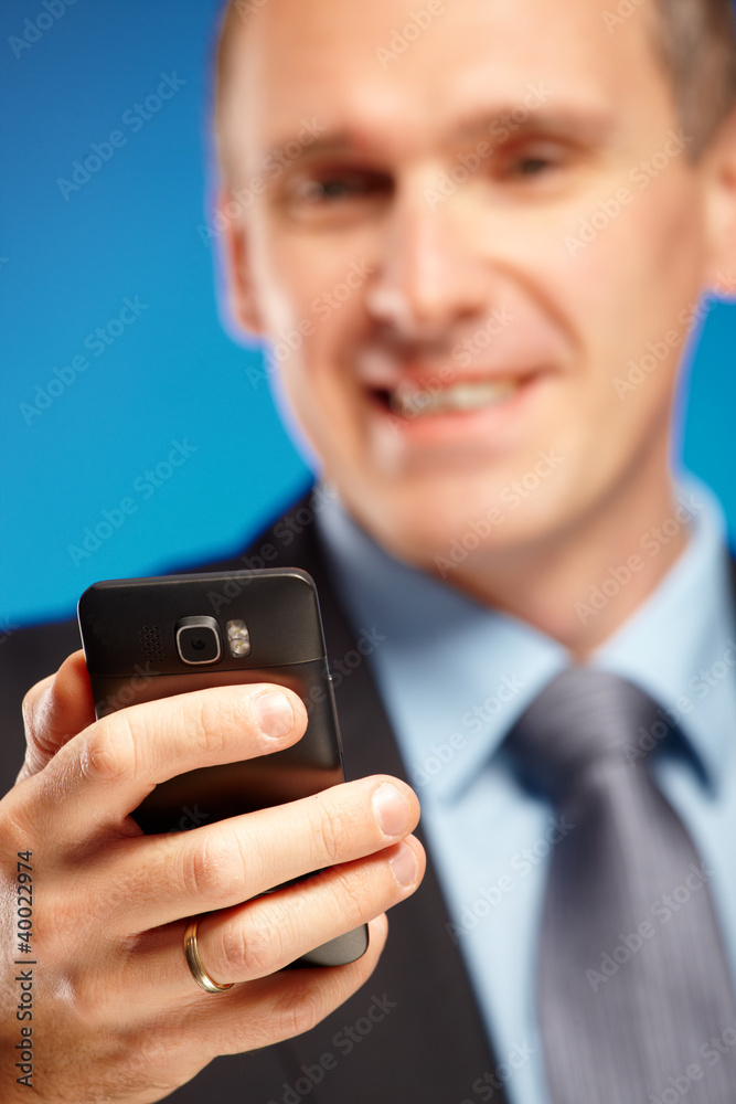 Business man using his mobile phone