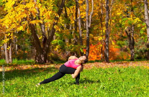 Yoga parivrita parshvakonasana pose photo