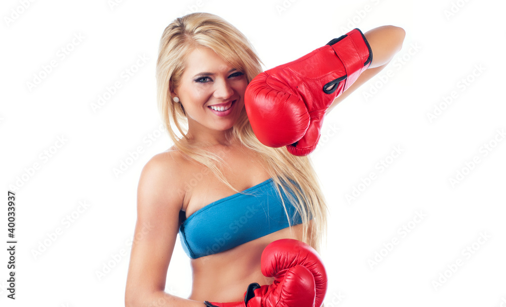 Photo of young wonderful woman wearing boxing glove Photo of young wonderful woman wearing boxing glove