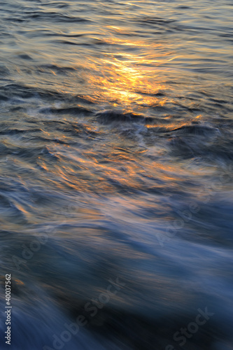 Golden reflections on the ocean surface.