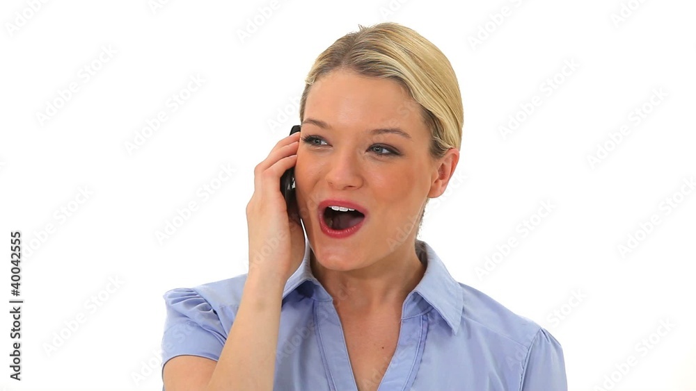Smiling blonde woman talking on the phone Smiling blonde woman talking on the phone