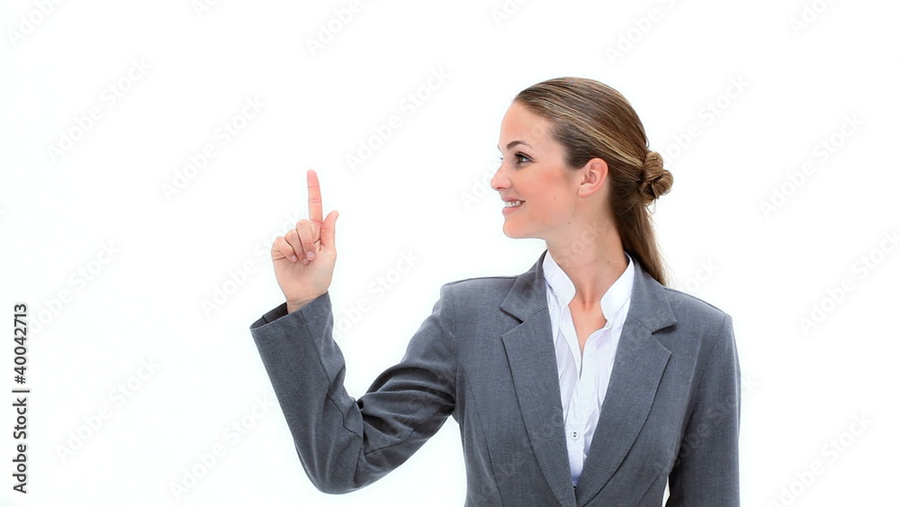 Smiling woman pointing her finger up Smiling woman pointing her finger up