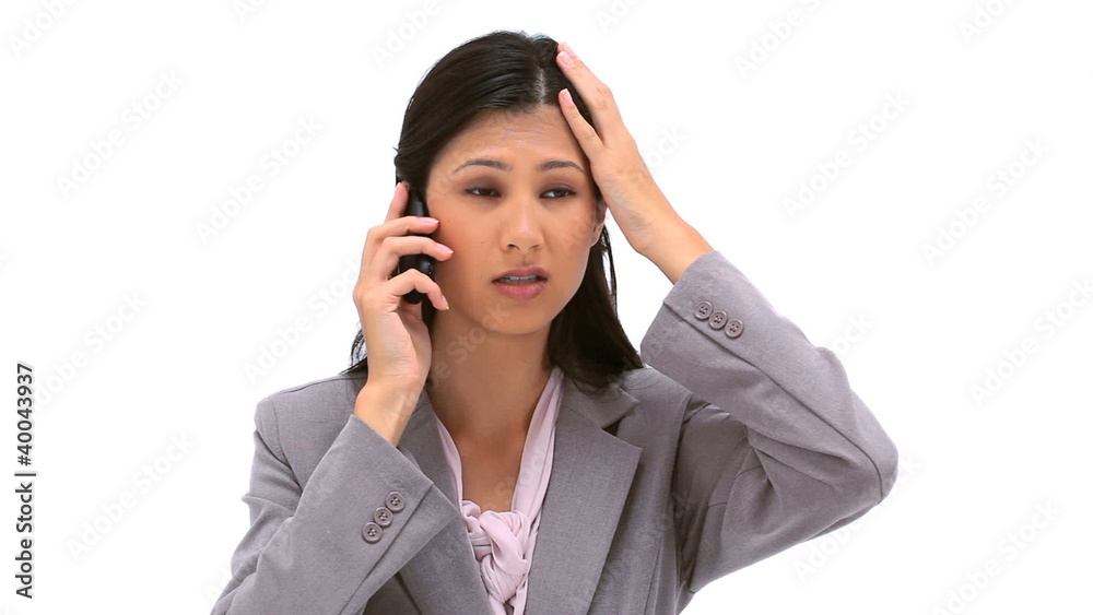 Brunette woman using her mobile phone Brunette woman using her mobile phone