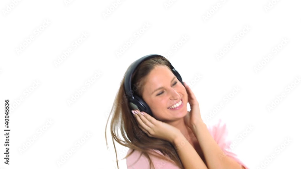 Woman with headphones is dancing and jumping Woman with headphones is dancing and jumping