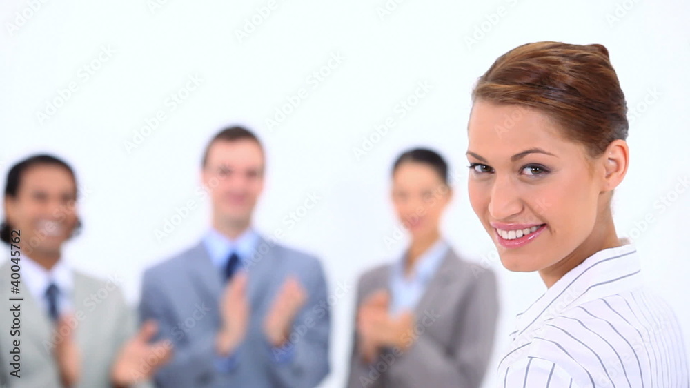 Woman being congratulated by her colleagues Woman being congratulated by her colleagues