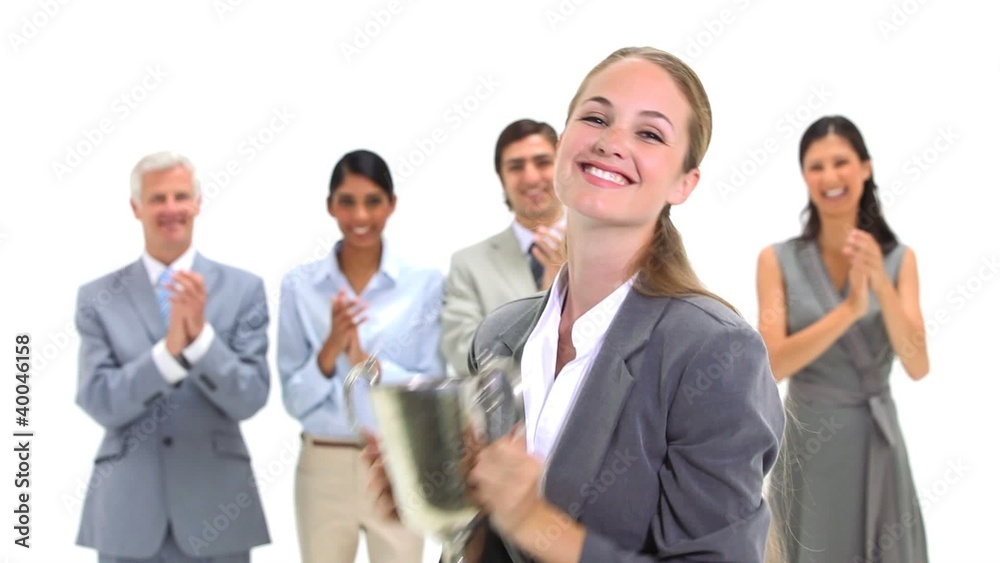 Blonde businesswoman holding a trophy Blonde businesswoman holding a trophy