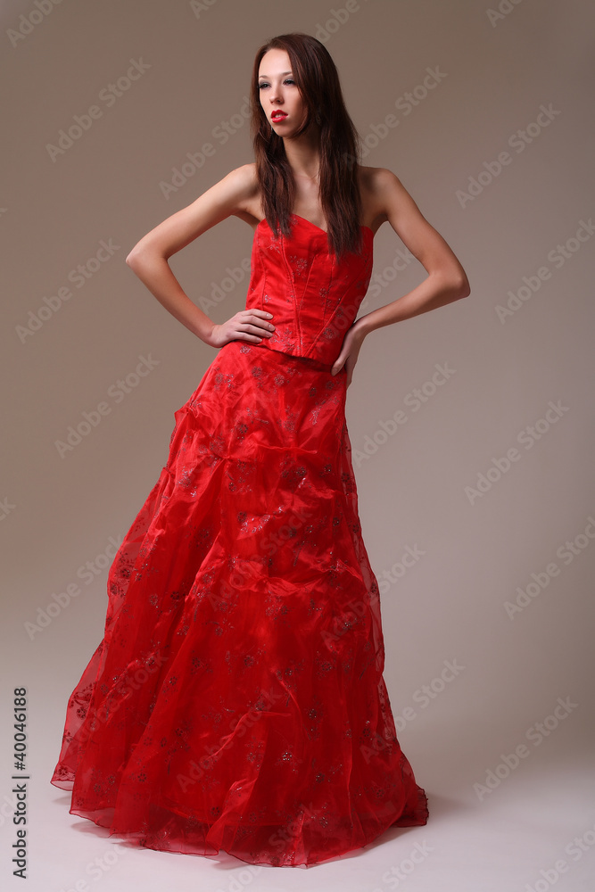 Young fashion model in red dress Young fashion model in red dress