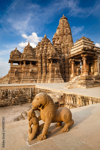 King and lion fight statue and Kandariya Mahadev temple