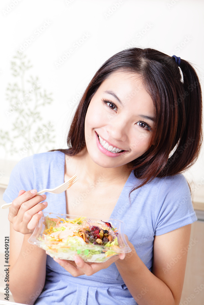 Young Girl Happy Eat salad at home
