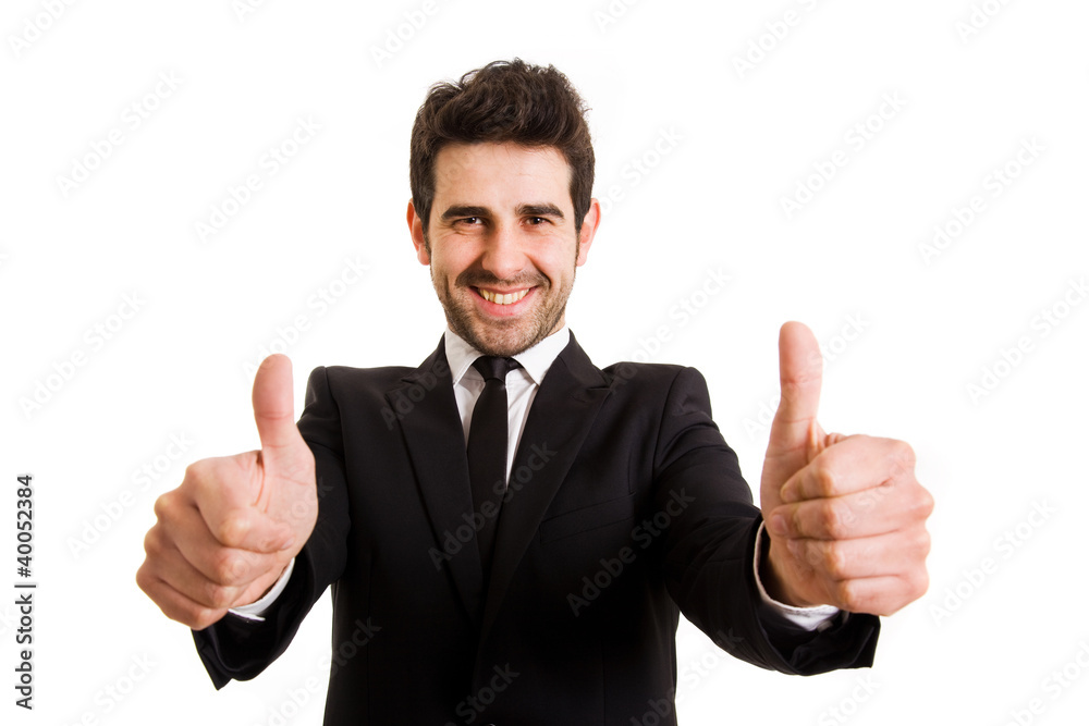 Smiling young business man thumbs up, isolated on white Smiling young business man thumbs up, isolated on white