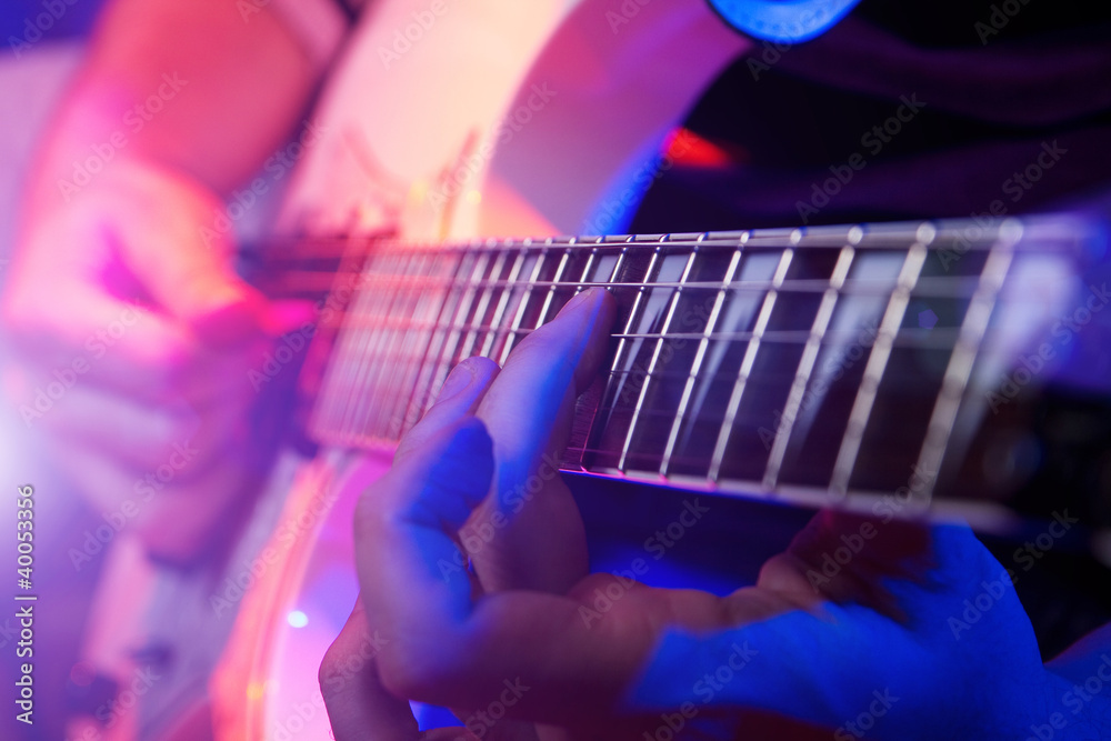 Naklejka premium young male musician with a white guitar