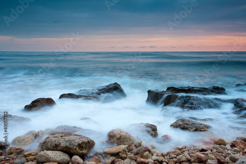 Beautiful rocky sea beach at the sunset © Sea Wave