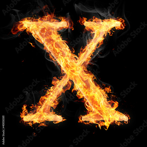 Fonts and symbols in fire on black background - X