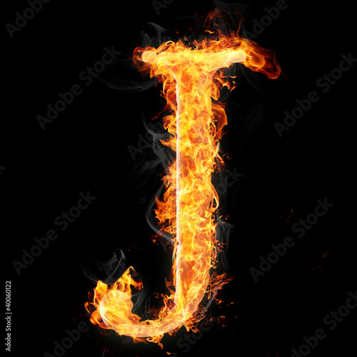 Fonts and symbols in fire on black - J