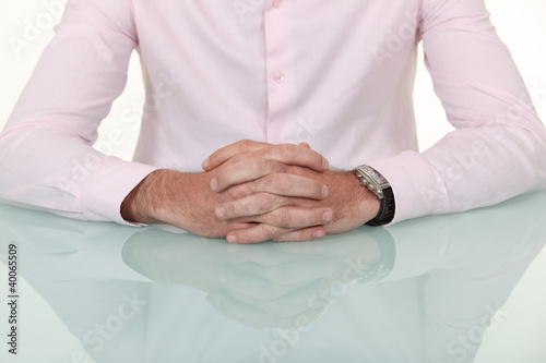 A cropped picture of a businessman's hands.