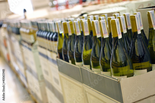 wine in bottles in wine shop