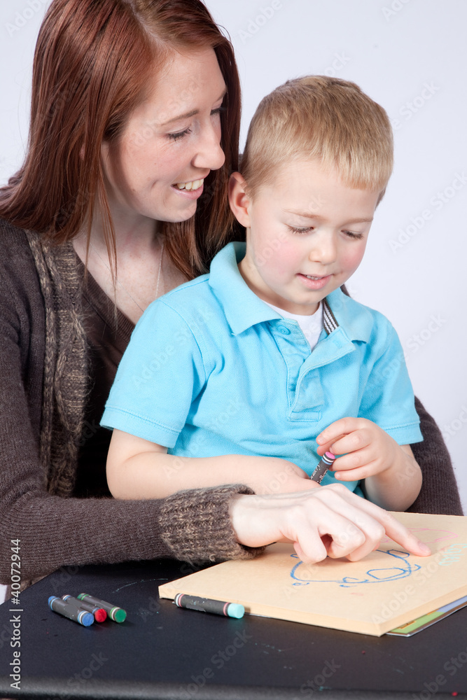 mother and son drawing and coloring together