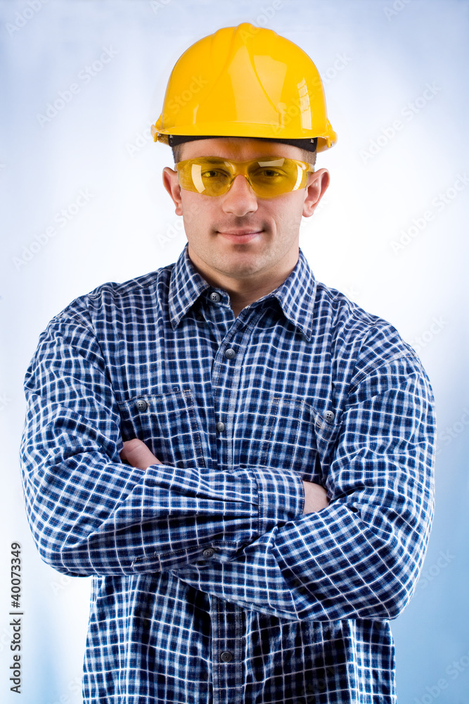 worker in a hardhat and yellow goggles worker in a hardhat and yellow goggles