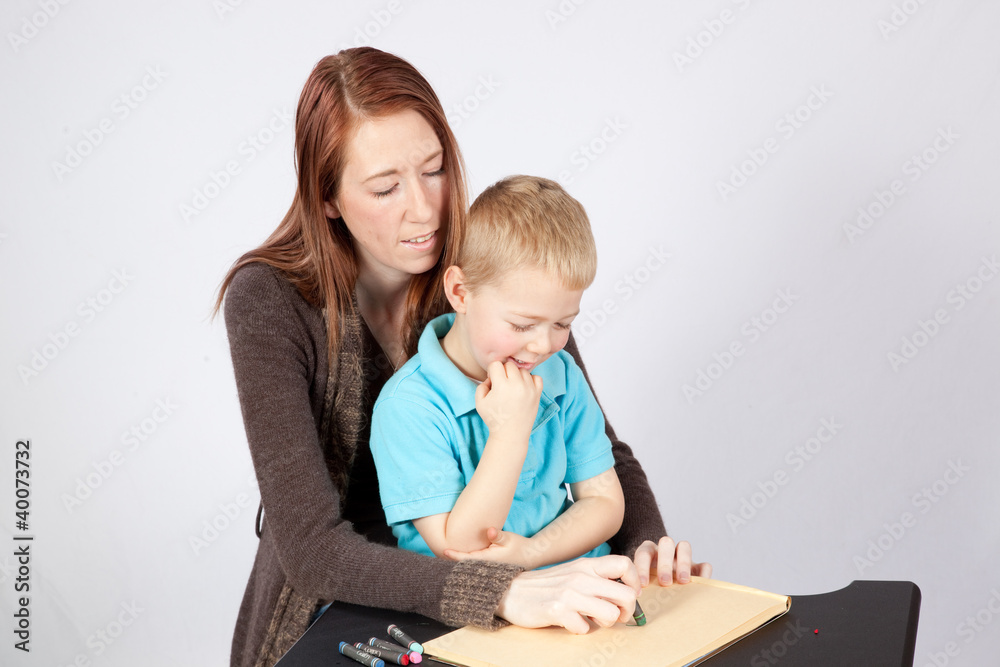 Mother and son drawing and coloring together Mother and son drawing and coloring together