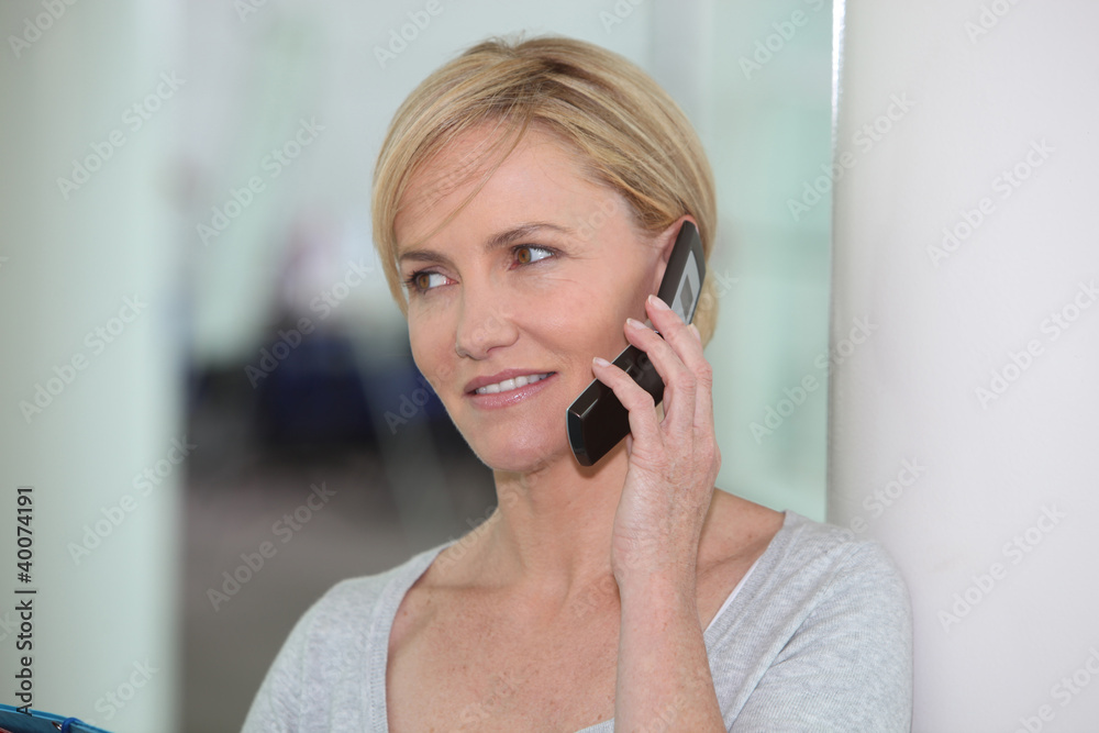 Woman using a cellphone Woman using a cellphone