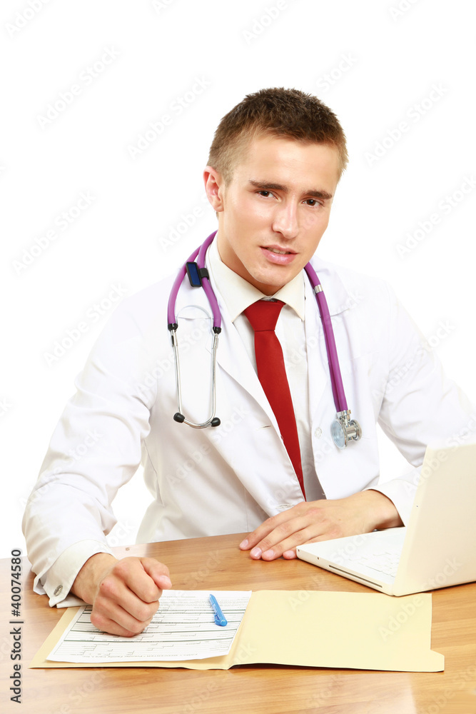 A male doctor working at a workplace, isolated on white A male doctor working at a workplace, isolated on white