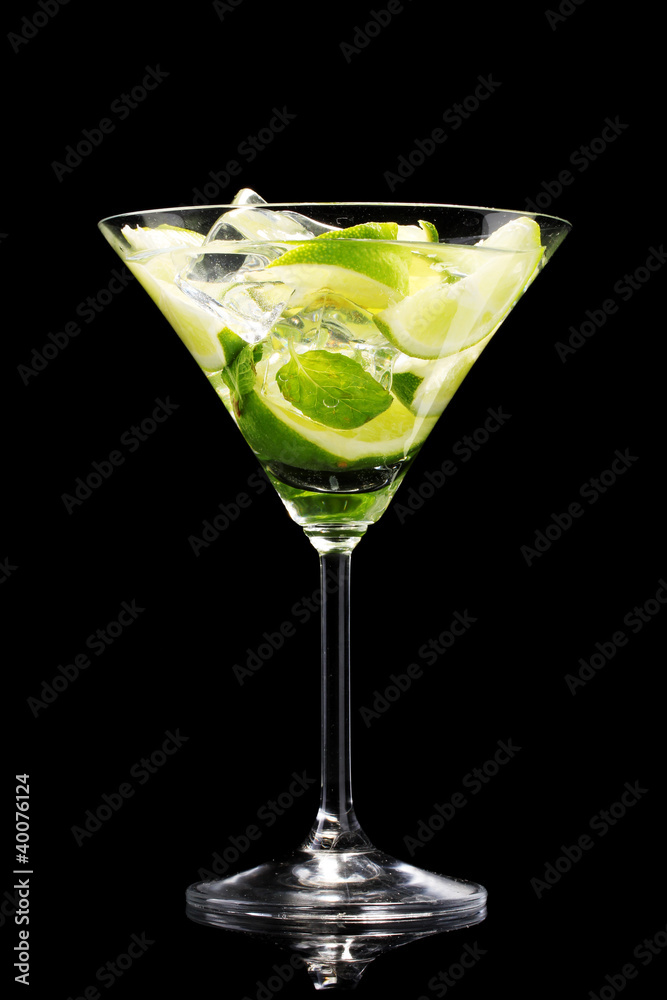 glass of cocktail with lime and mint on black background glass of cocktail with lime and mint on black background
