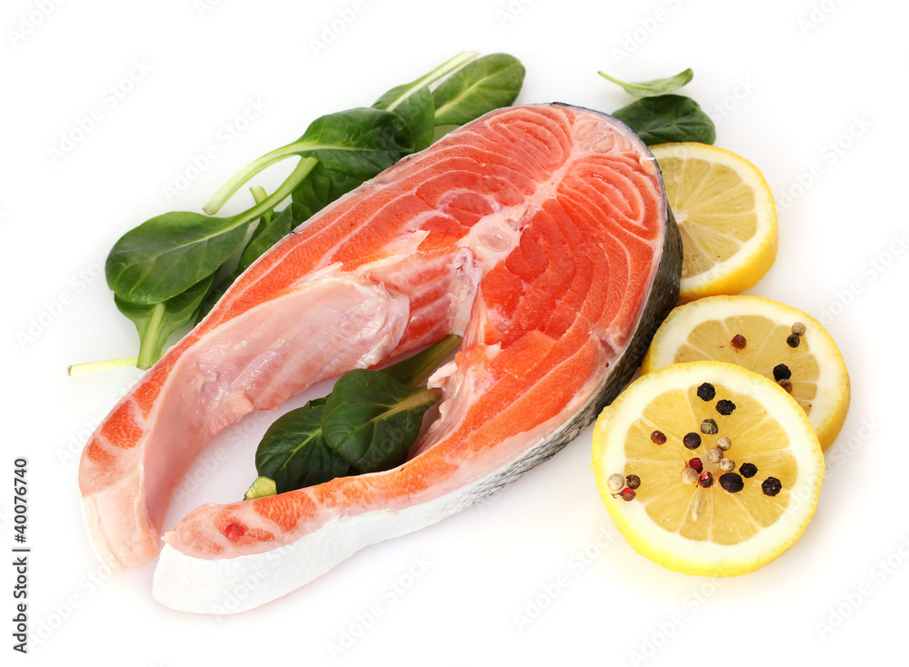 Red fish with lemon, green leaves and pepper isolated on white. Red fish with lemon, green leaves and pepper isolated on white.