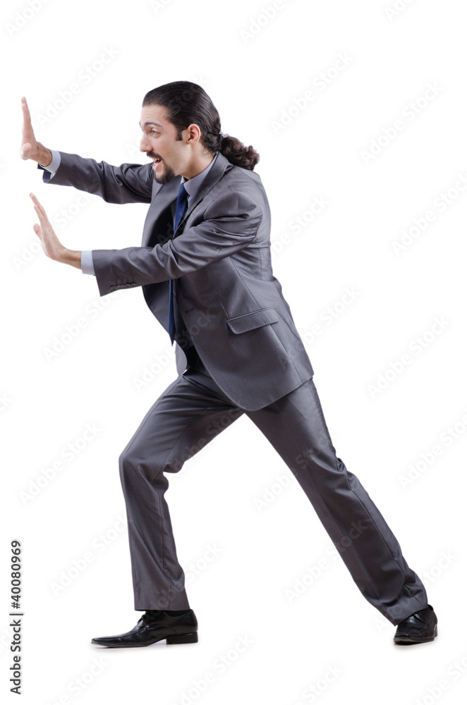 Obraz premium Businessman pushing away virtual obstacles