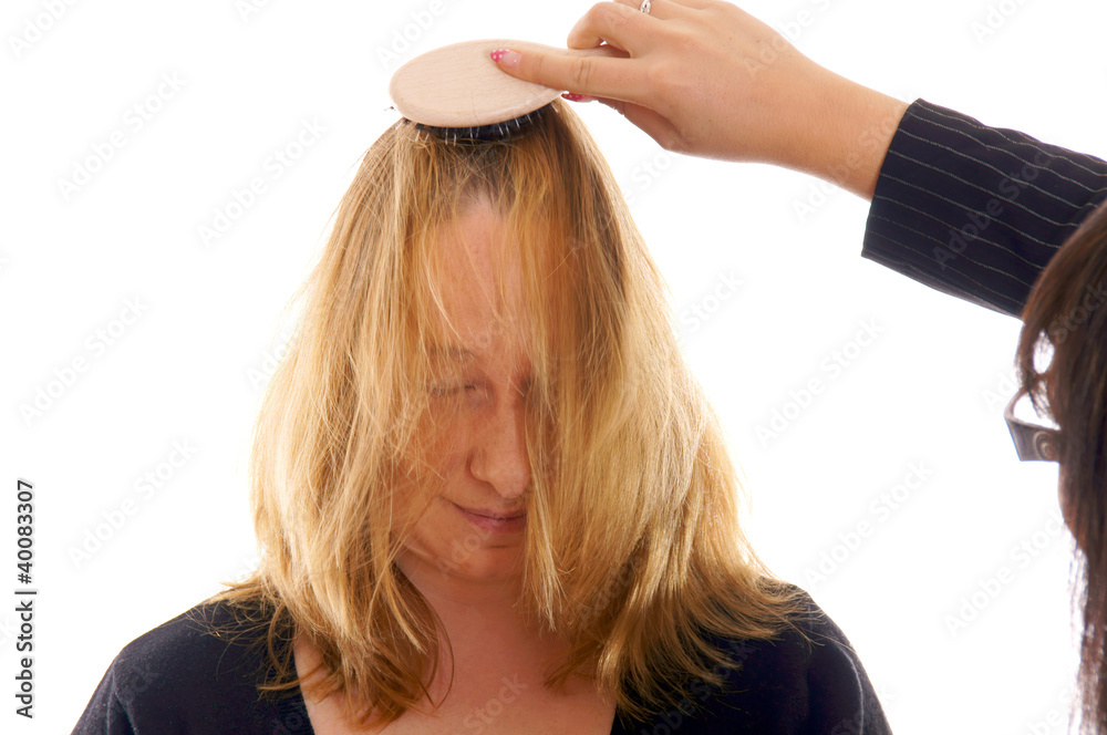 Fototapeta premium Portrait of a young woman at the hairdresser