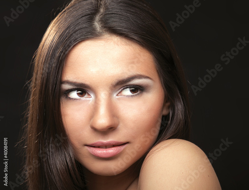 A portrait of a beautiful woman isolated on black background