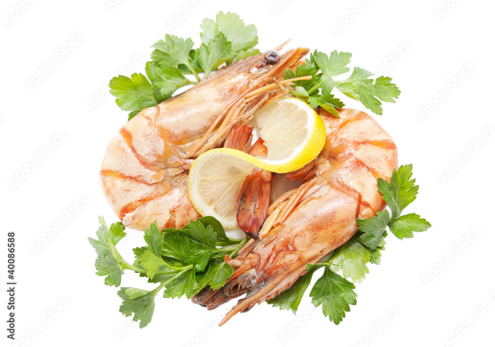 two appetizing tiger shrimps with lemon slice and parsley