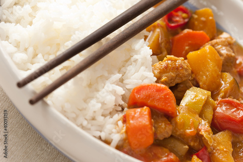 Delicious pork curry served with hot Thai jasmine rice